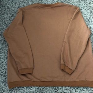Brownish orangish long sleeve shirt